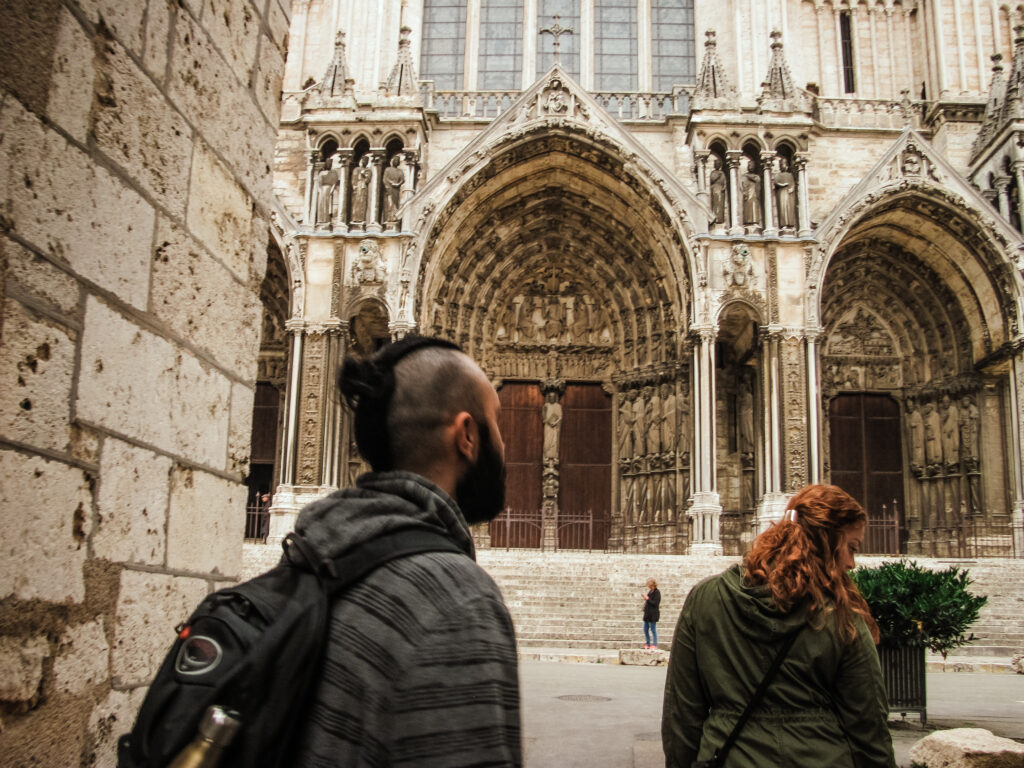 View from a street looking at the right side of Chartres Cathedral.