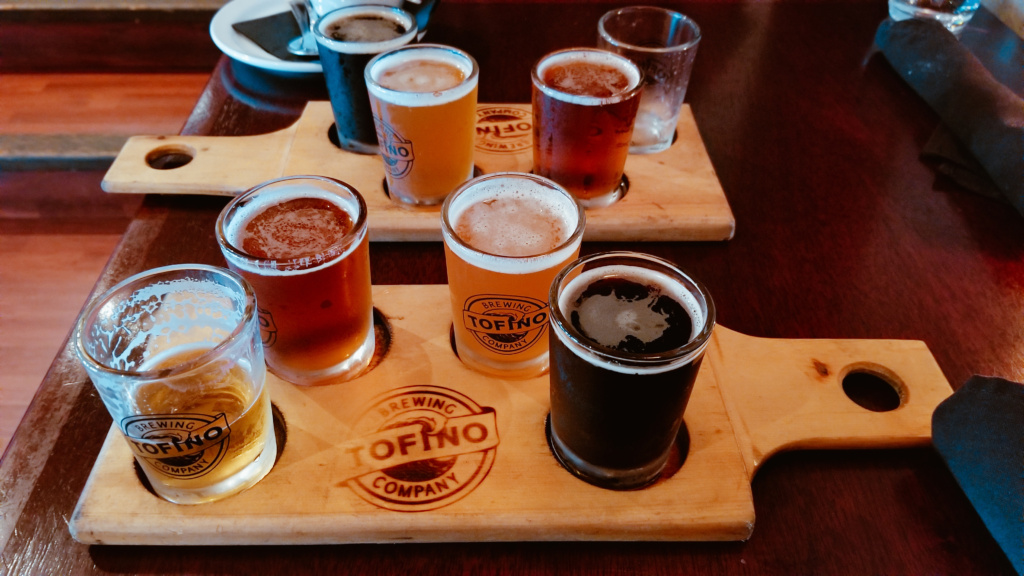 Two flights on beer from the Tofino Brewing Company on a restaurant table. 